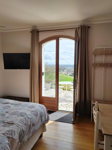 Ένα ή περισσότερα κρεβάτια σε δωμάτιο στο Gîte Belle vue au Gros Caillou, 13mn du Zoo de Beauval