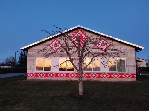 a small tree in front of a building at Puhkemaja Peretuba in Obinitsa
