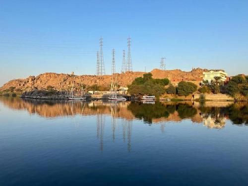 a large body of water with boats in it at ACHERTOD Nubian House in Naj‘ al Maḩaţţah