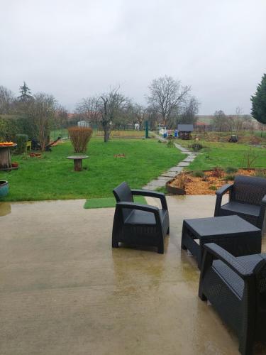 three black benches sitting in a flooded park at Les Tourterelles in Laquenexy