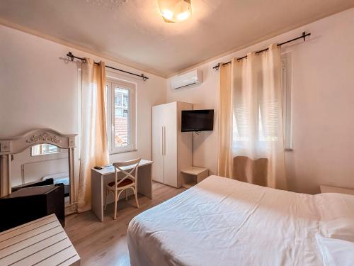 Postel nebo postele na pokoji v ubytování Hotel Alba