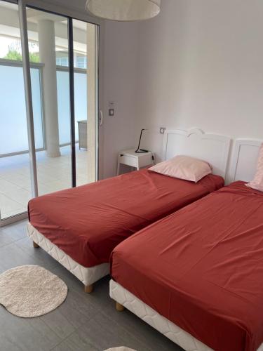 Postel nebo postele na pokoji v ubytování les rivages de calvi