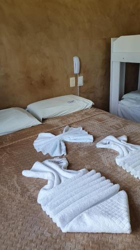 Postel nebo postele na pokoji v ubytování Apartamentos Beira Mar Marinas Tamandare PRAIA DOS CARNEIROS