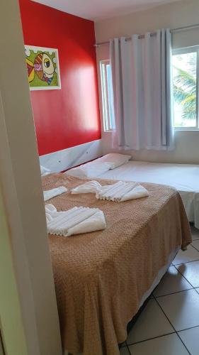 Postel nebo postele na pokoji v ubytování Apartamentos Beira Mar Marinas Tamandare PRAIA DOS CARNEIROS