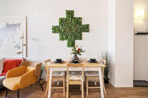 a dining room with a table and chairs at Eminence Sleek Studio City View in Edmonton