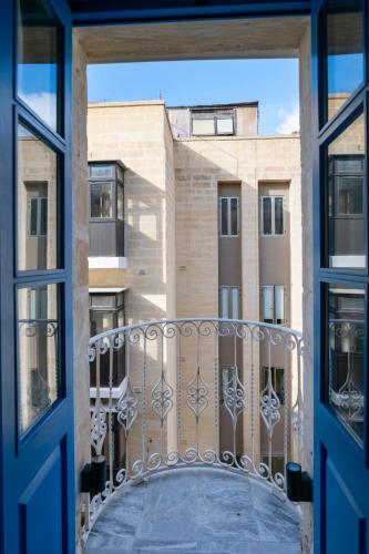 a view from a window of a building at Mandera's Boutique Suites & Dorms in Valletta