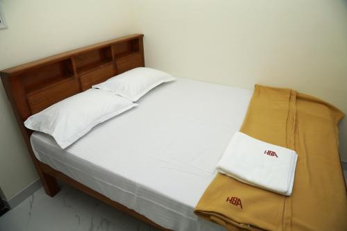 Ένα ή περισσότερα κρεβάτια σε δωμάτιο στο Happy Serviced Apartments