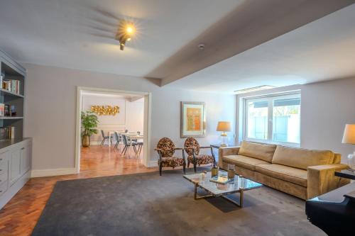 a living room with a couch and a table at AvenueHillHotel in Lisbon