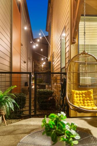 a bird cage filled with yellow food on a patio at THE PENDLETON - Walkable - Arcade Loft - Modern- Light & Bright in Eugene