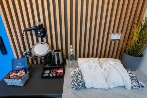 a table with two towels and other items on it at Mandera's Boutique Suites & Dorms in Valletta