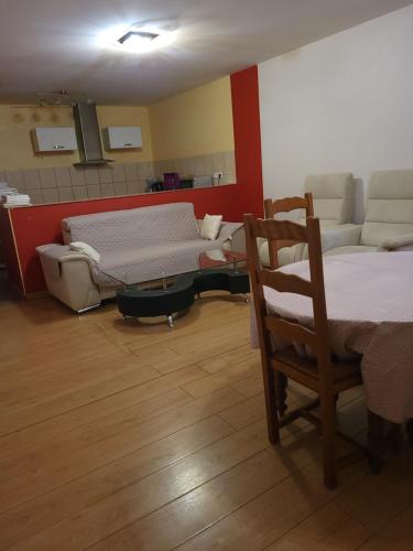 a living room with a bed and a couch at CHAPELLE ST NICOLAS in Roanne