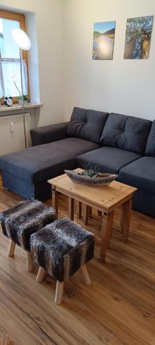 a living room with a couch and a coffee table at Apartman Arberblick 20 in Bayerisch Eisenstein