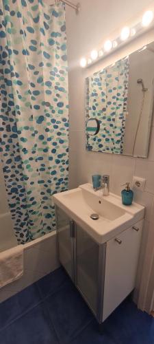 a bathroom with a sink and a shower at Apartamento Azul in Nerja
