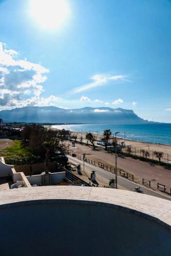 a view of the beach and the ocean from a building at DV holiday home in Isola delle Femmine
