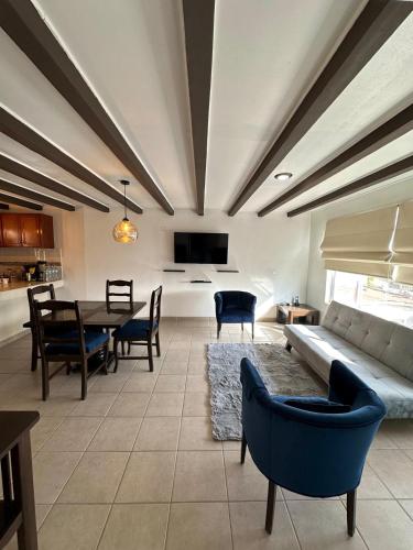 a living room with a couch and a table at Rocky Suite, close to everything in Ensenada