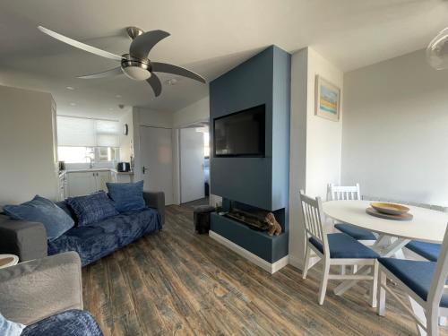 a living room with a couch and a table at Beach Buoys holiday chalet Close to the dog friendly beach in Bridlington