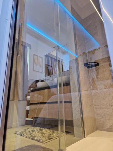 a glass window in a room with a bed at HOME Carpediem 2 in Verona