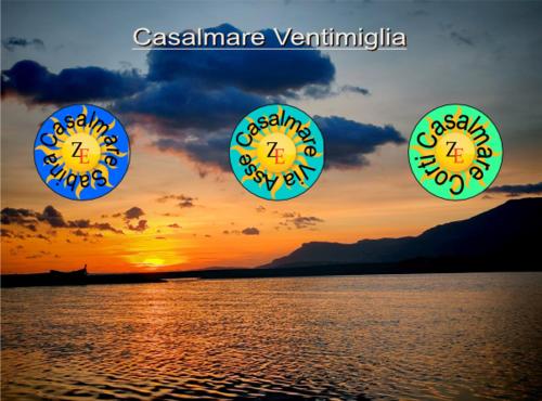 three clocks with the sun setting in the sky over the water at Casalmare Sabina in Ventimiglia