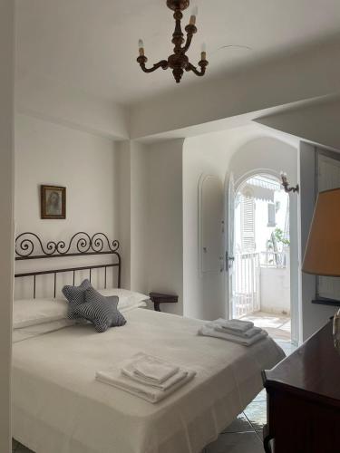 a bedroom with a bed with towels on it at La Casa di Audrey in Capri