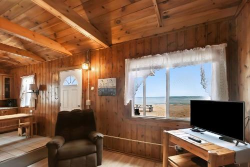 a room with a desk with a computer and a window at Sunnyside Combined 6BR 3BA Lakefront Retreat in Lincoln Junction