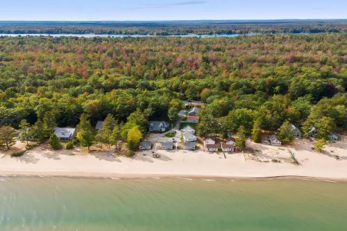an aerial view of a beach with houses and trees at Sunnyside Combined 12BR 5BA Lakefront Retreat in Lincoln Junction