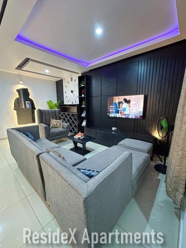 TV a/nebo společenská místnost v ubytování ResideX Apartment