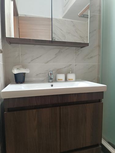 a bathroom sink with two candles on top of it at Panos House - Warm and cozy retreat in Tríkala