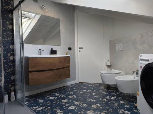 a bathroom with a sink and a toilet at Relaxing Break Lario in Gravedona