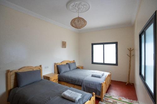 Postel nebo postele na pokoji v ubytování Tayda Guest House