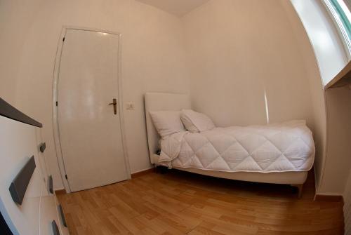 En eller flere senge i et værelse på Nuovo appartamento - Casa D'Amaldi