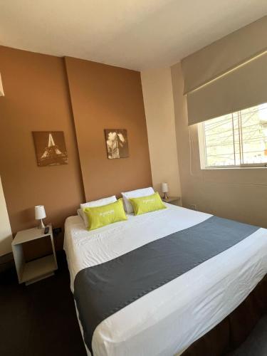 Postel nebo postele na pokoji v ubytování B&B Wasi Airport Lima