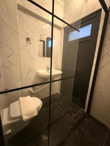 a bathroom with a toilet and a sink at The Pera Hotel Marmaris in Marmaris