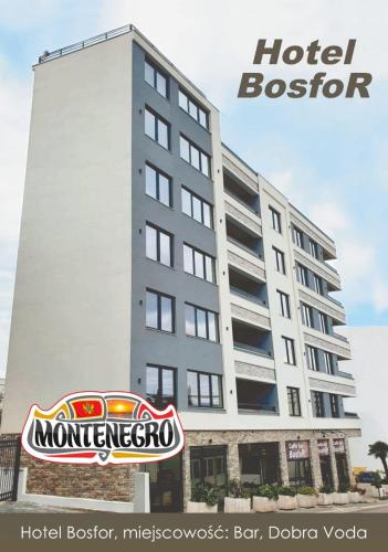 a hotel sign in front of a building at Apartmani Bosfor in Dobra Voda