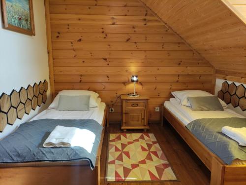 Postel nebo postele na pokoji v ubytování Dolina Biebrzy - Ośrodek Agroturystyczny
