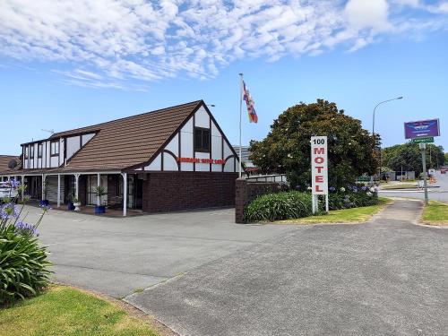 a building with a sale sign in front of it at Pakuranga Motor Lodge in Auckland