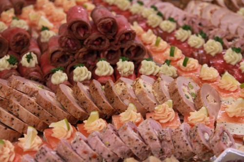 a display of different types of food on a table at PRIMAVERA Hotel & Congress centre in Plzeň