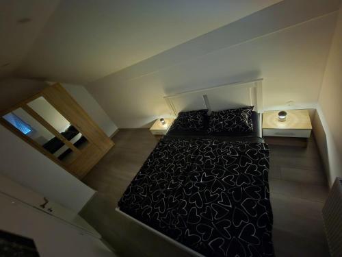 Ένα ή περισσότερα κρεβάτια σε δωμάτιο στο Apartman Roko