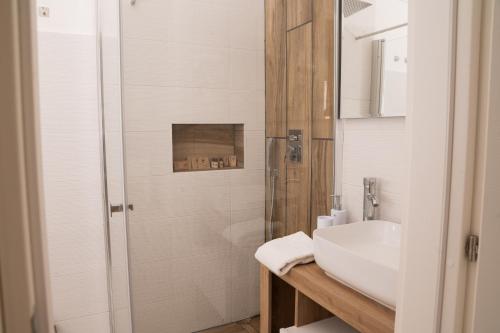 a bathroom with a sink and a shower at Lmholiday SUNSET apartment in Torre Canne