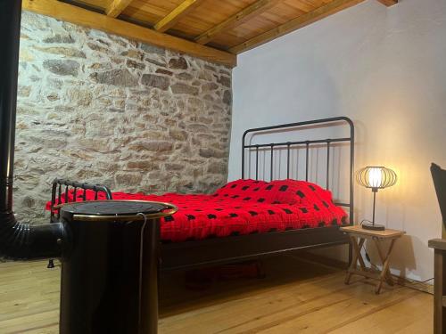 Ένα ή περισσότερα κρεβάτια σε δωμάτιο στο Aveleira EcoCasa