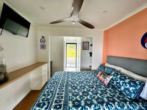 a bedroom with a bed and a ceiling fan at Haven Ridge in North Haven