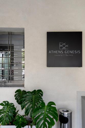 a sign on a wall next to a plant at Athens Genesis Luxury Suites By SEM in Athens