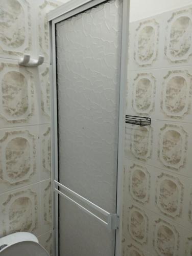 a shower stall with a glass door in a bathroom at Hotel Casa Real Málaga Santander in Málaga