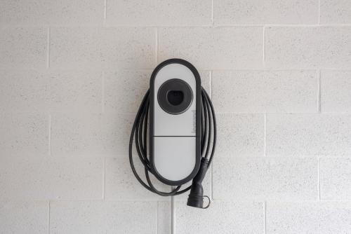 a camera hanging on a wall with a mirror at Molly Apartments in Formigine