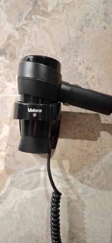 a black camera sitting on top of a table at Lux GUEST HOUSЕ МUKACHEVO in Mukacheve