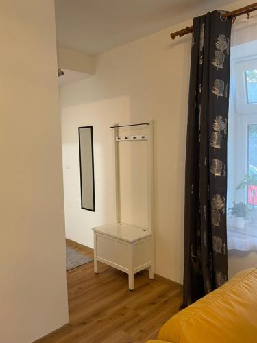 a room with a mirror and a bed and a window at New Apartment near to Elbe bicycle path in Roudnice nad Labem