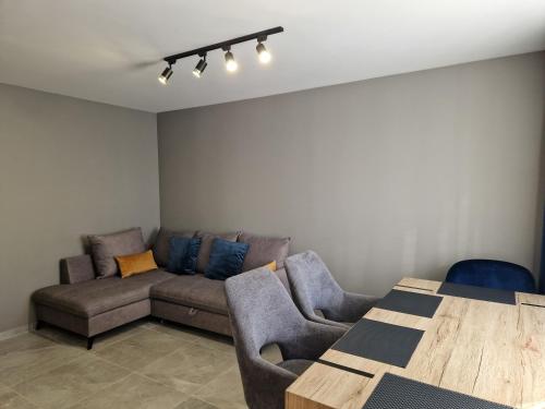a living room with a couch and a table at VIN service Atbrivosanas alley 119 in Rēzekne