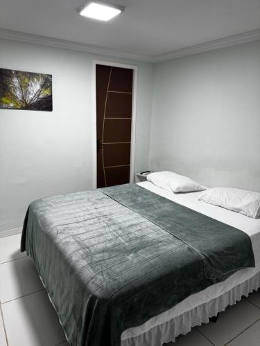 Кровать или кровати в номере Pousada Alameda Boa Vista