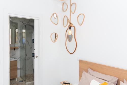 a room with a bed and a mirror on the wall at Gyula Old Town Apartment in Albufeira