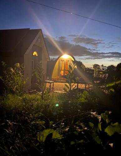 a house with the sun shining inside of it at Fennor Park Lodge in Oldcastle