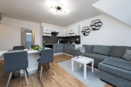 Kuchyň nebo kuchyňský kout v ubytování ALAVIA Residence